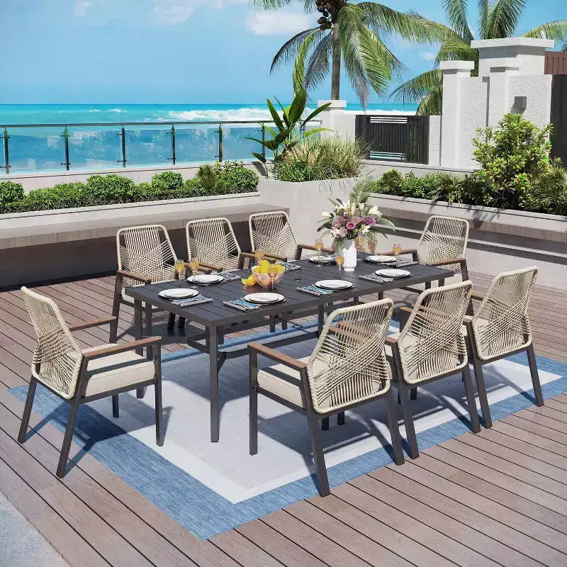 Captiva Designs – Ensemble de salle à manger d'extérieur 9 pièces, table rectangulaire en acier et chaises en osier fixes avec coussins épais